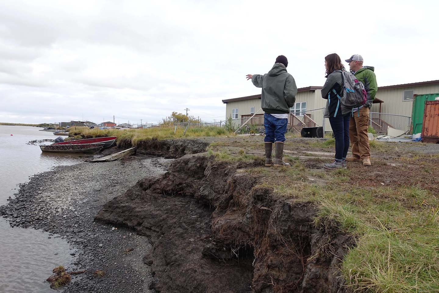 Kotlik Natives in Alaska survey usteq damage on the riverfront (Photo: ANTHC)